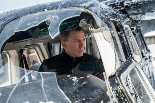 photo of Daniel Craig as James Bond, in the cockpit of a crashed helicopter